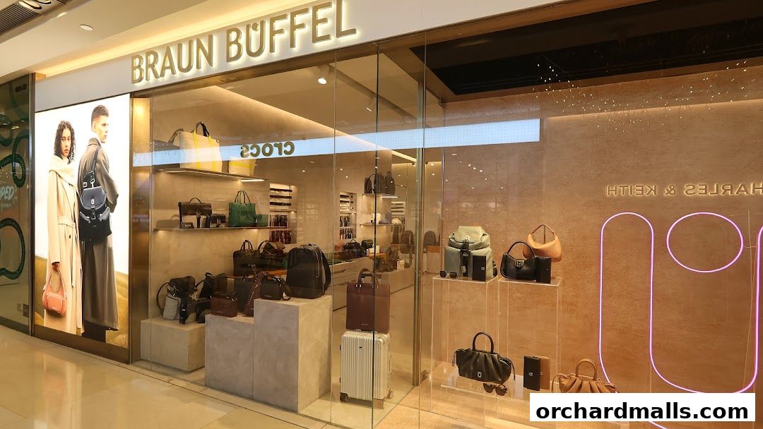 The Braun Büffel ION shop front displays a variety of stylish handbags and accessories in a well-lit, modern setting.
