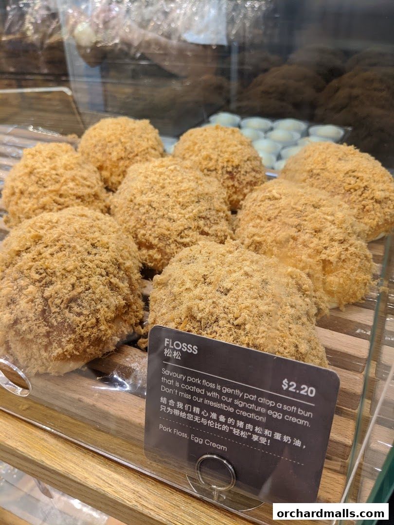 A display of fluffy buns coated in savory pork floss at BreadTalk.
