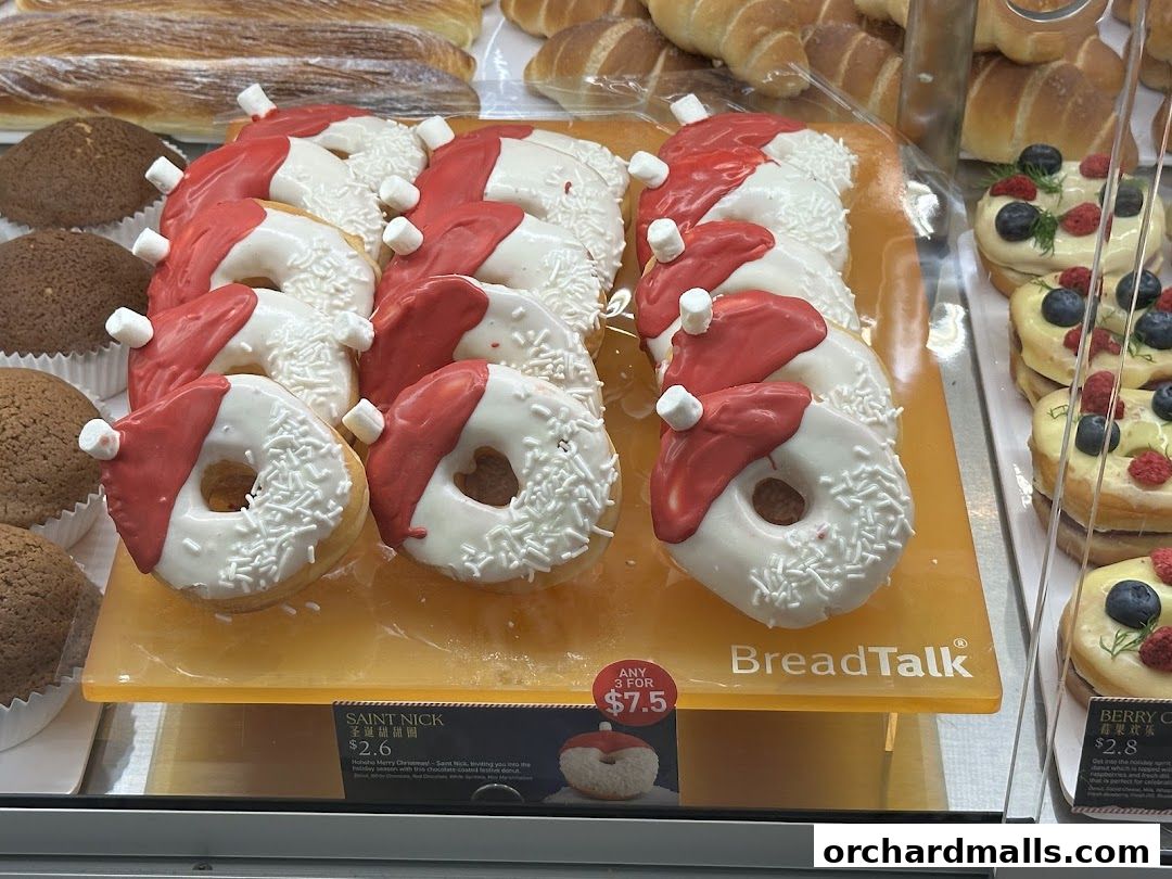 A display of festive Christmas-themed donuts and other baked goods at BreadTalk.