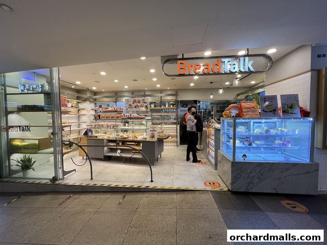 The exterior of a BreadTalk bakery showcasing a display of pastries and breads.