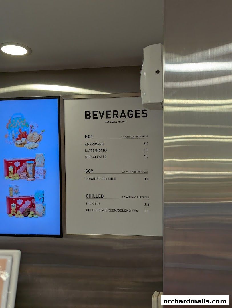 A menu board displaying hot and chilled beverages with prices at BreadTalk.