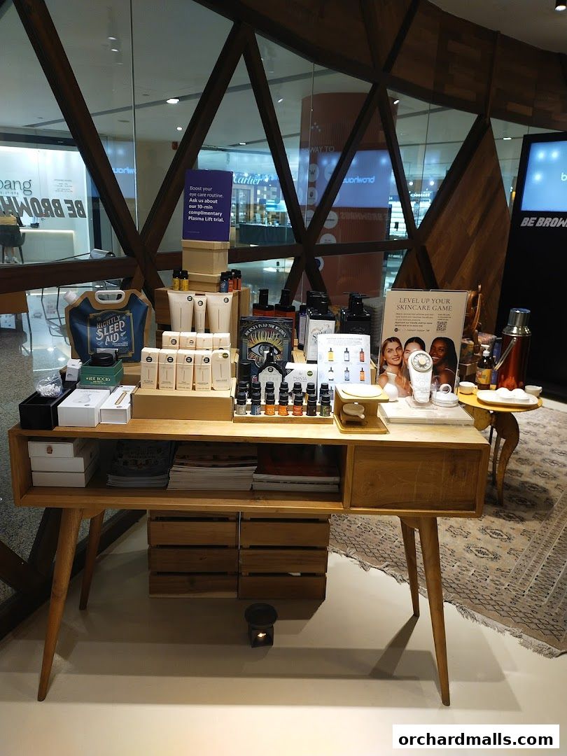 A display table showcasing skincare products and promotional materials for Browhaus.