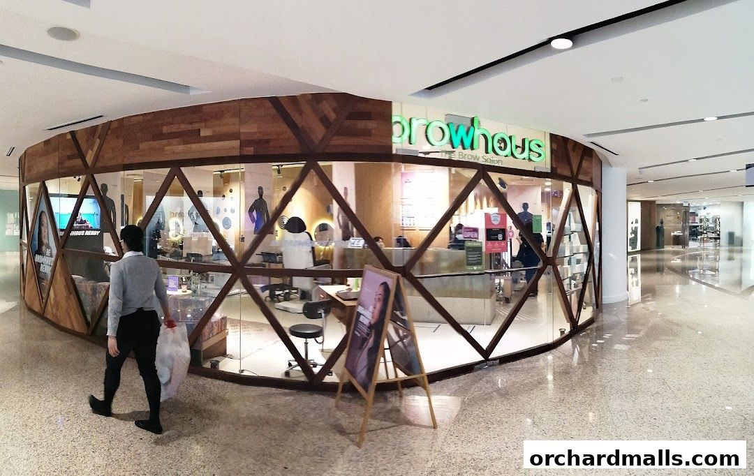 The exterior of Browhaus, a brow salon, with a modern wooden and glass facade.