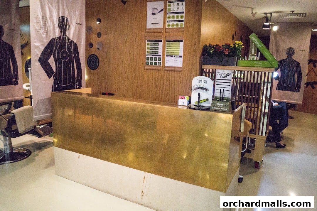 A reception desk with posters of target silhouettes and beauty products displayed.