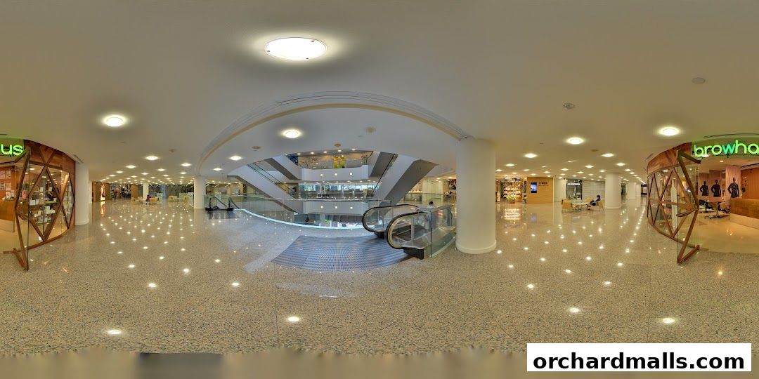 Interior view of a shopping mall with the Browhaus shop visible.