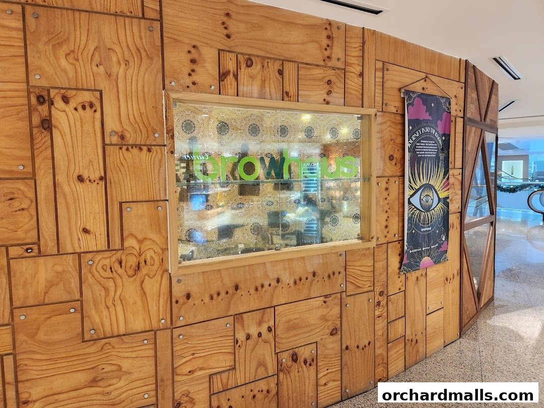 The exterior of Browhaus Wheelock, featuring a wooden facade and a window display.