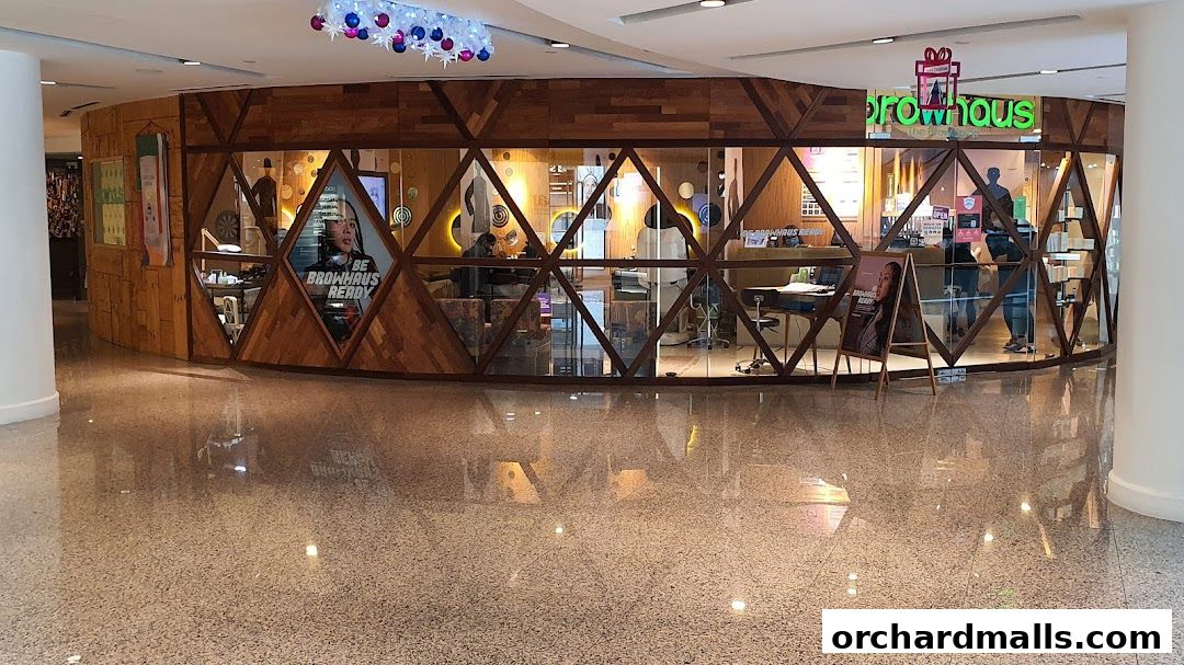 The exterior of Browhaus Wheelock, a beauty salon with a distinctive wooden geometric facade.
