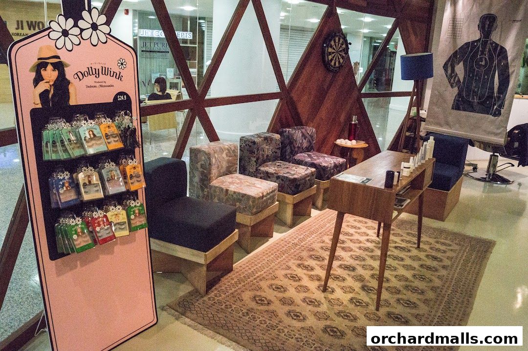 A display of Dolly Wink eyelashes and a seating area with a treatment table.