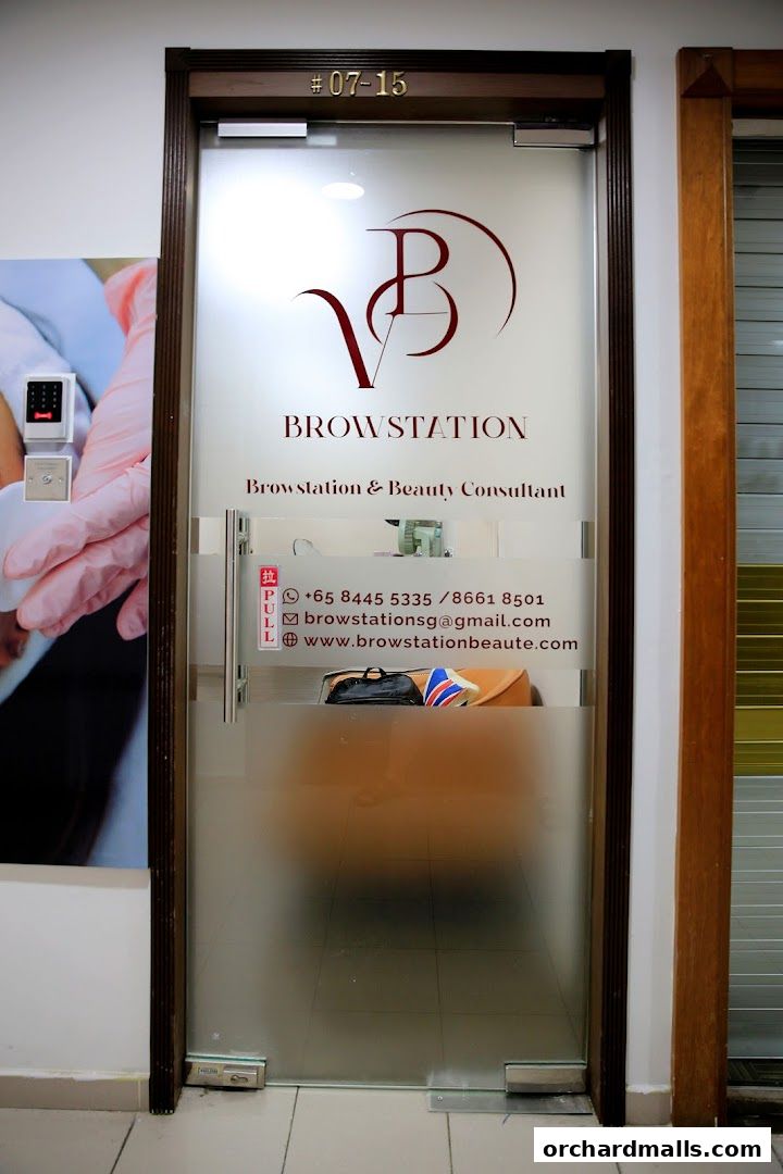 The entrance door of Browstation Beaute, a beauty consultant shop, with contact information displayed.