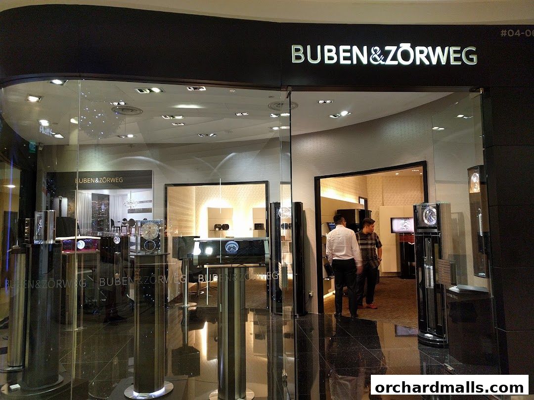 The entrance of Buben & Zorweg, a luxury watch and accessory store, showcasing display cases.