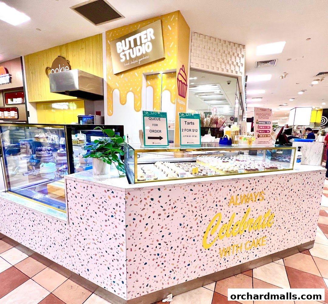 Butter Studio Takashimaya Food Hall display of cakes and tarts with a 'Queue for Order' sign.