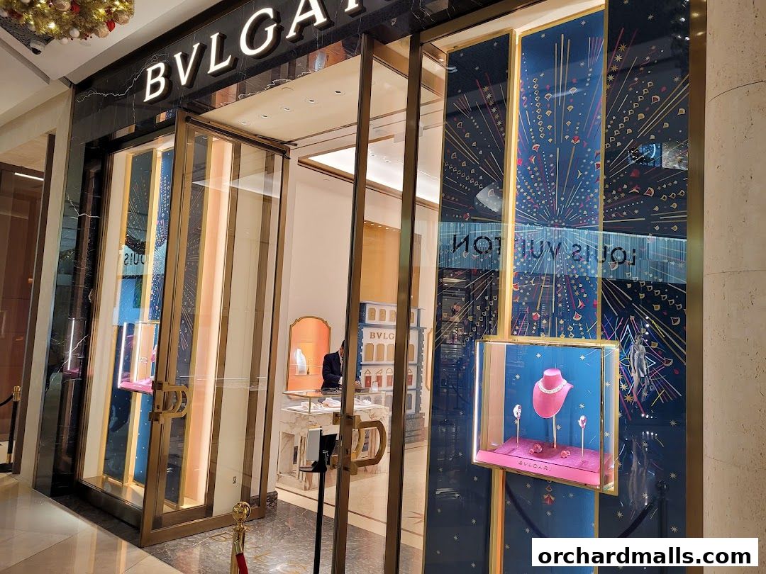 The elegant BVLGARI Singapore ION Orchard store entrance with illuminated displays and luxurious jewelry.