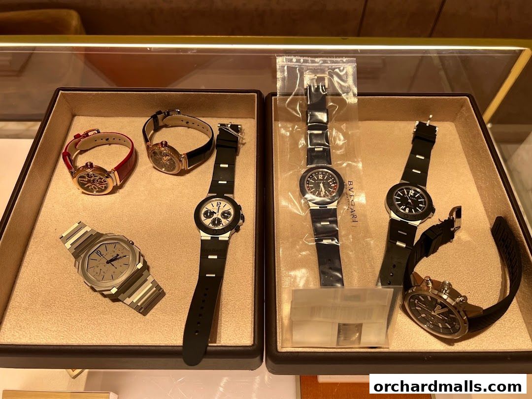 A display of various luxury Bvlgari watches in a retail setting.