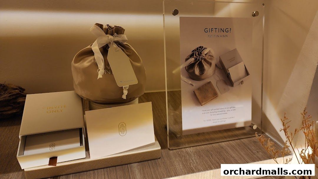 Jewelry gift packaging and a promotional sign for gifting.