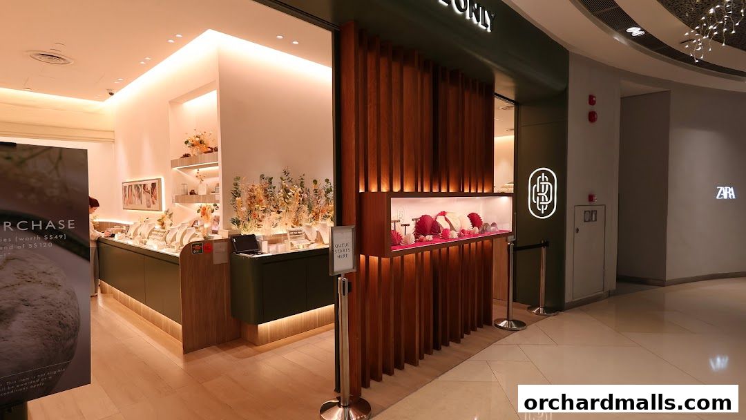 The elegant interior of By Invite Only Jewellery, showcasing displays of necklaces and jewelry.