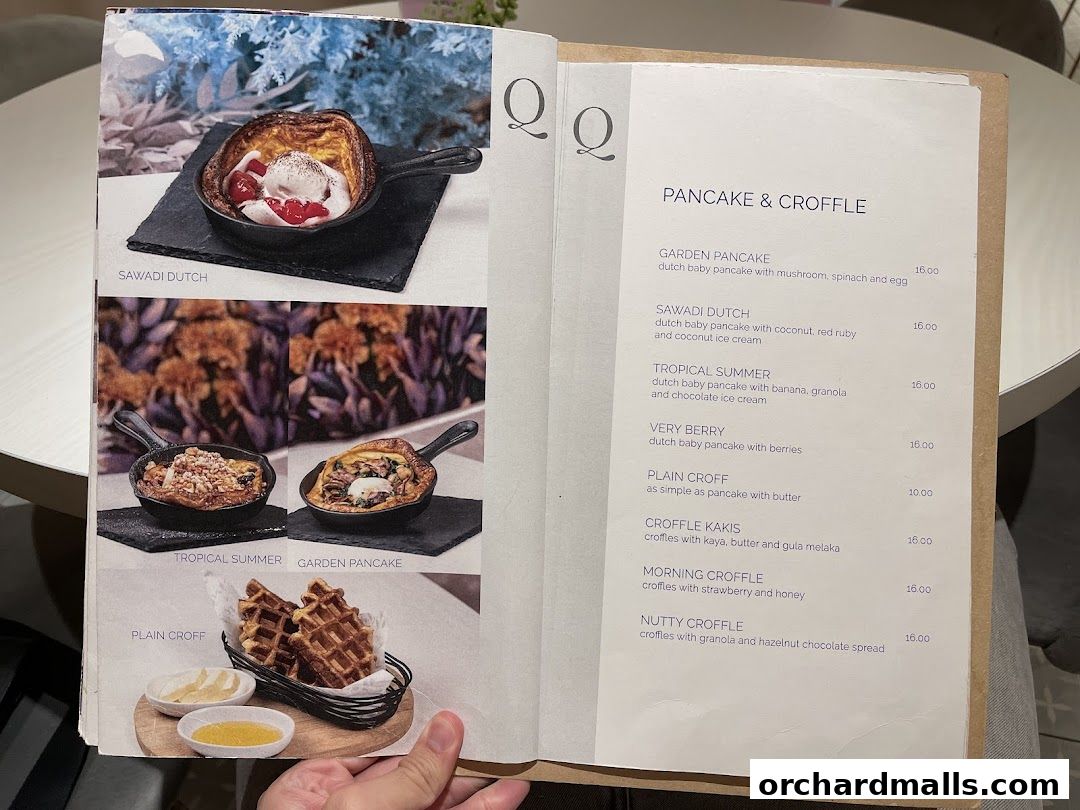 A menu page from Cafe Q Classified featuring pancakes and croffles with enticing descriptions and prices.