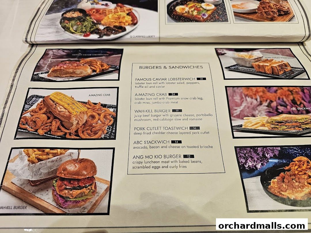 A menu from cafe Q Classified featuring burgers, sandwiches, and lobster dishes.