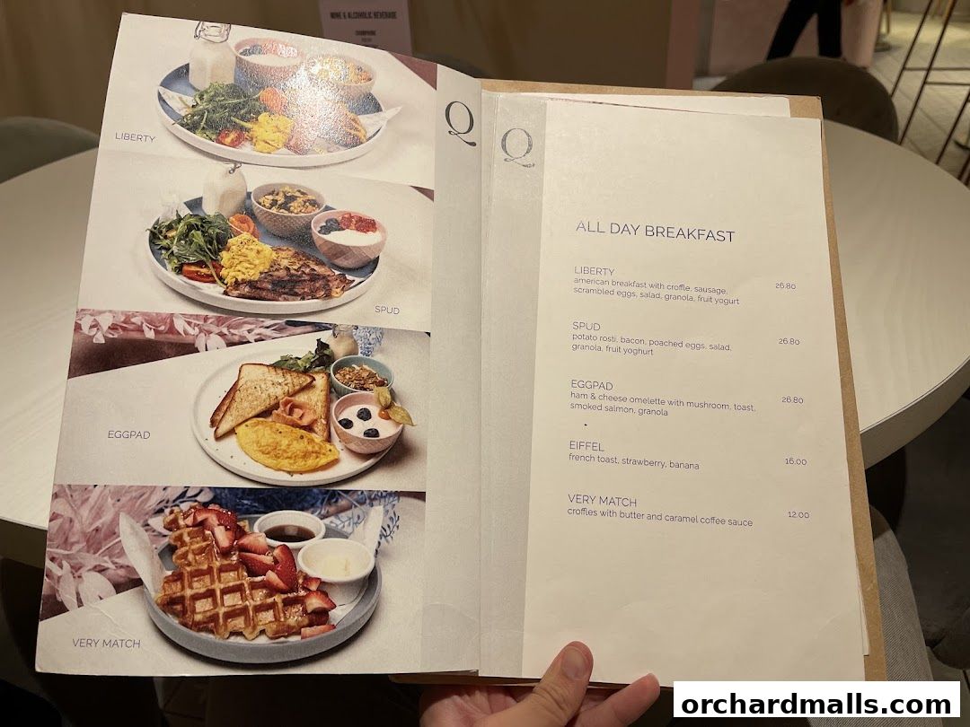 A menu from cafe Q Classified showcasing delicious all-day breakfast options.