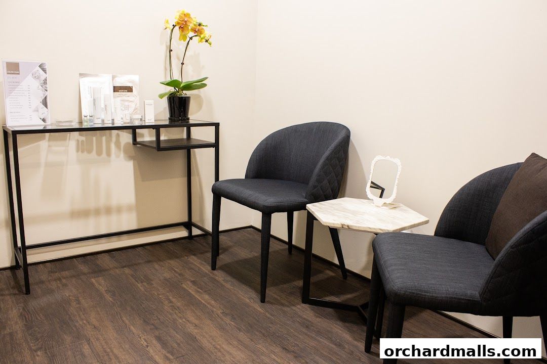 A waiting area with chairs, a console table with products, and a plant.