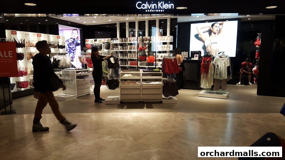 Calvin Klein Underwear store interior with mannequins, clothing displays, and a large advertisement.