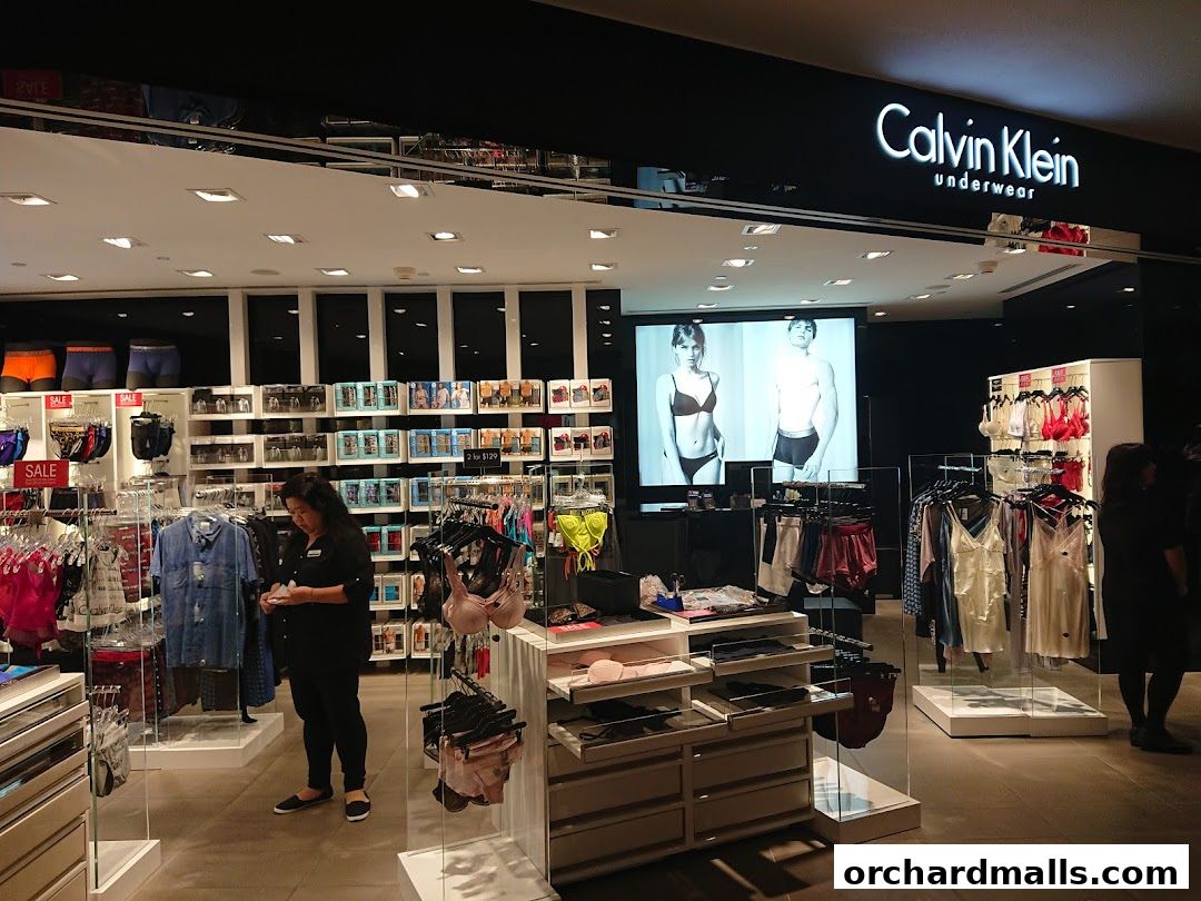 Interior of a Calvin Klein Underwear store showcasing various apparel and a promotional display.