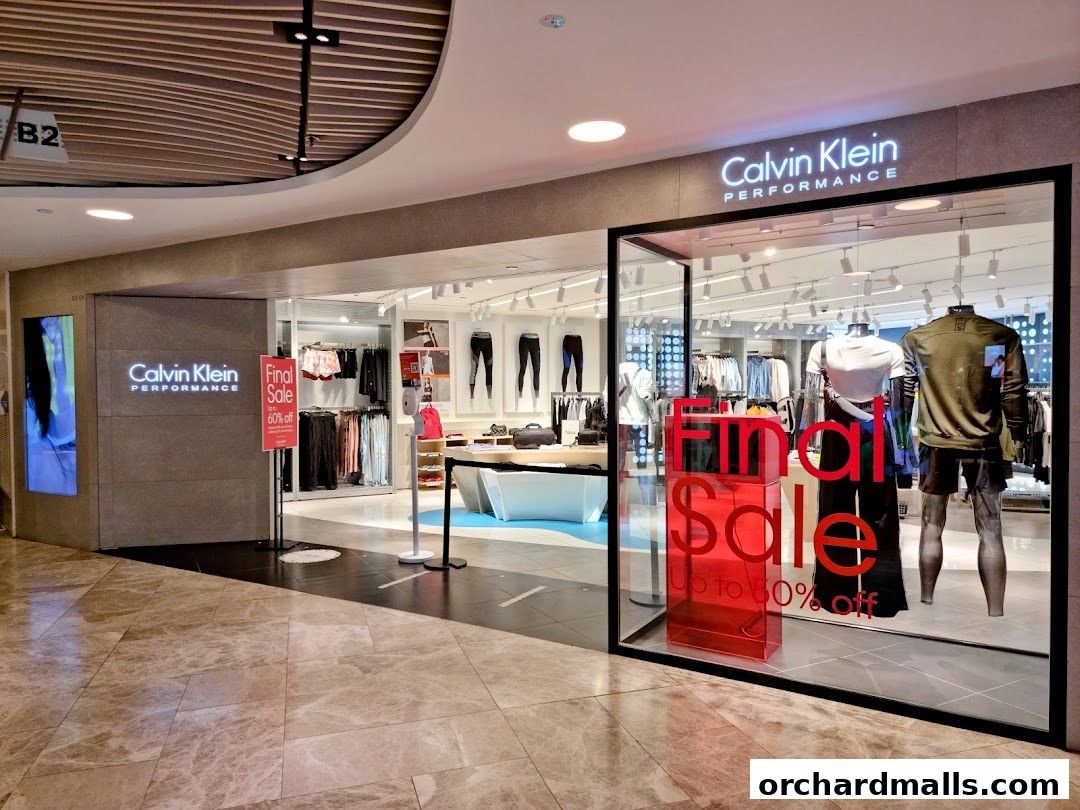 Calvin Klein Performance store with a final sale display and mannequins in the window.