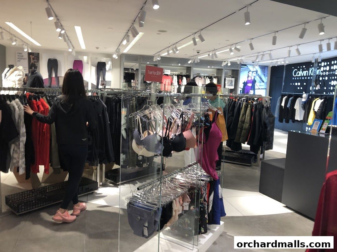 Interior view of a Calvin Klein Underwear store with clothing racks and mannequins.
