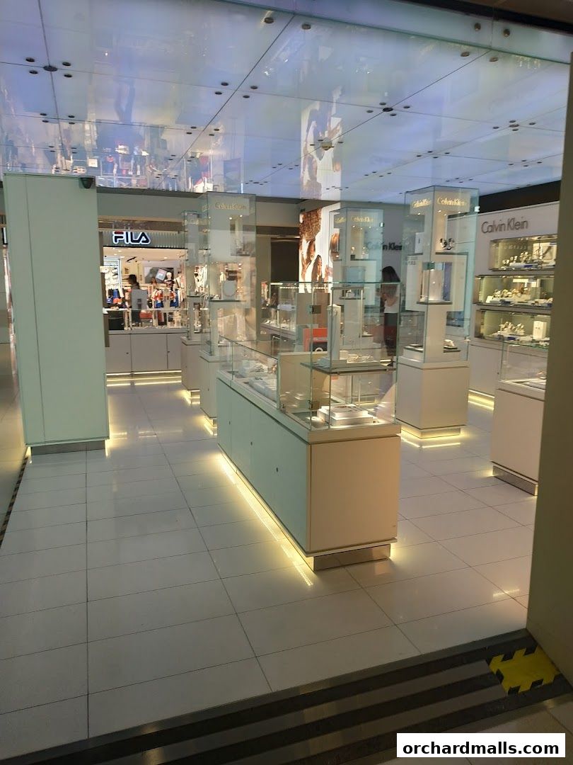 Interior view of a Calvin Klein Underwear store with display cases and lighting.