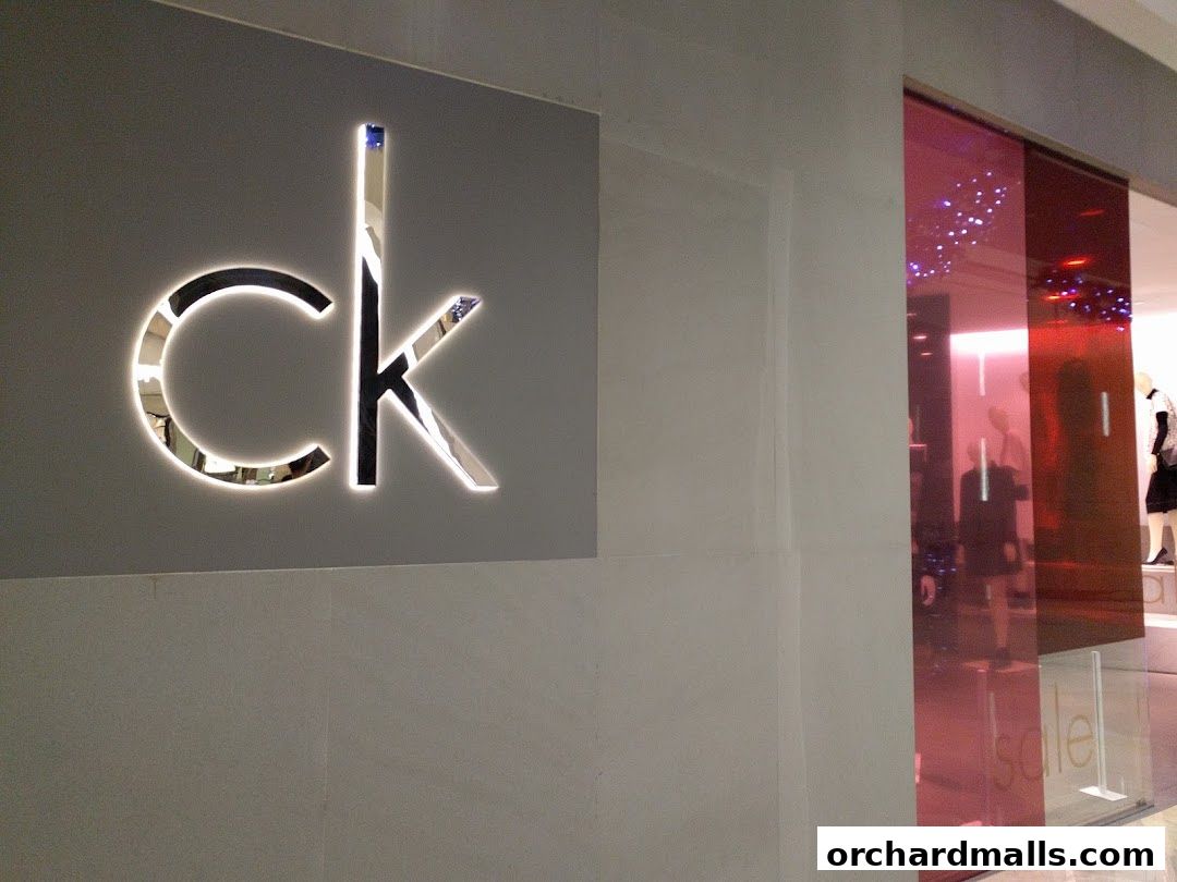 The Calvin Klein store entrance with its iconic logo and a glimpse of mannequins inside.