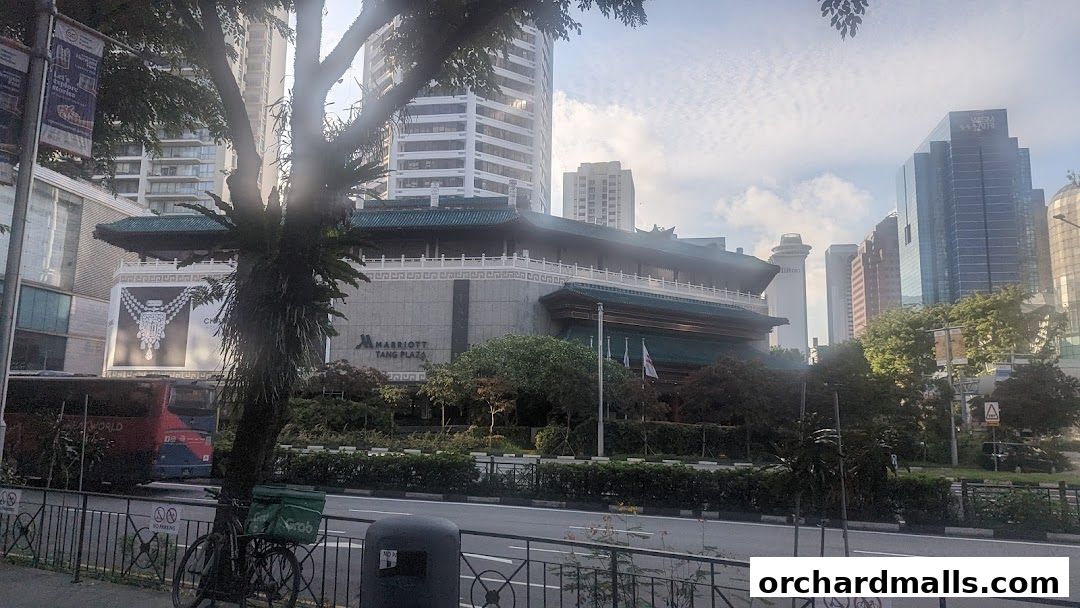 Marriott Tang Plaza hotel with surrounding cityscape and greenery.