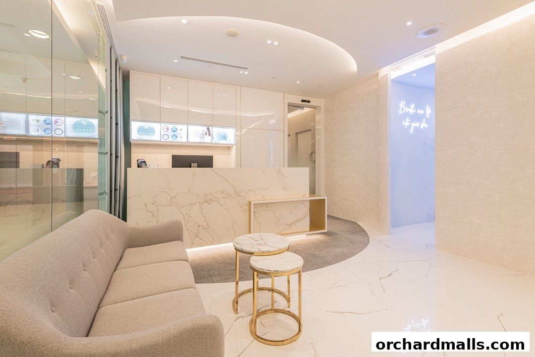Interior of a modern skincare clinic with a reception desk, seating area, and treatment rooms.