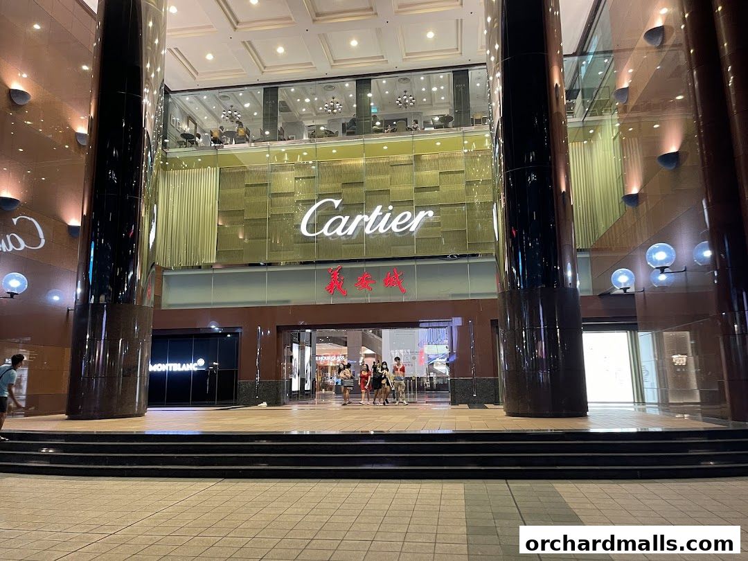 The exterior of the Cartier ION Orchard store, with its prominent signage and entrance.