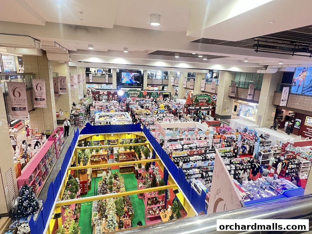 A bustling department store interior filled with Christmas decorations and merchandise.