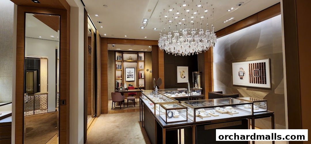Interior view of a luxurious Cartier boutique with display cases and elegant decor.