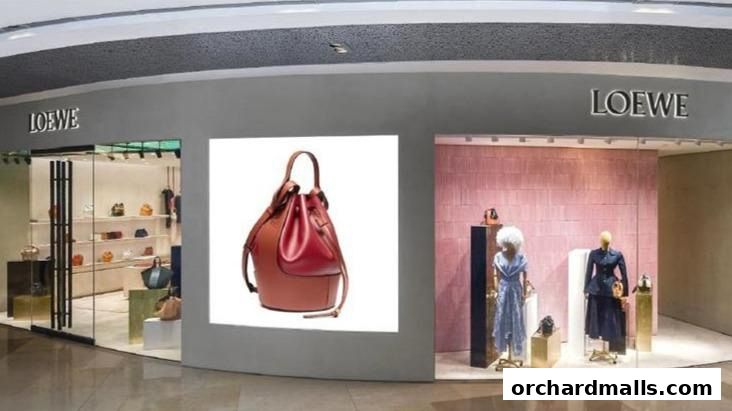 The exterior of a luxury fashion store, CASA LOEWE, showcasing handbags and mannequins in the window.
