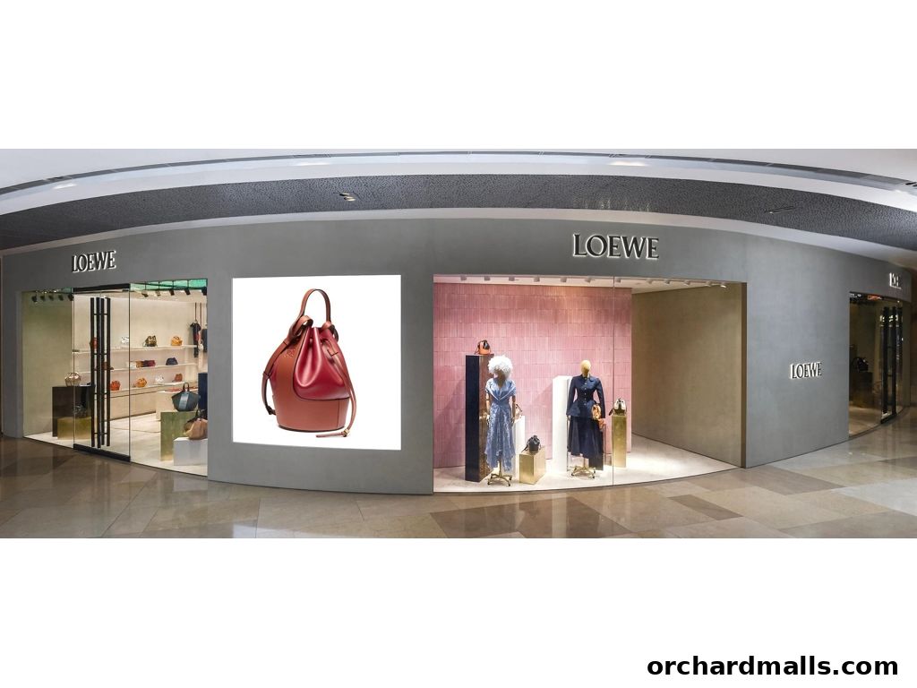 Exterior view of the CASA LOEWE Singapore luxury fashion store with window displays.