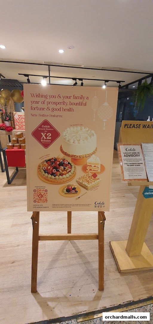 A festive sign at Cedele All Day Dining promoting new festive features and rebates.
