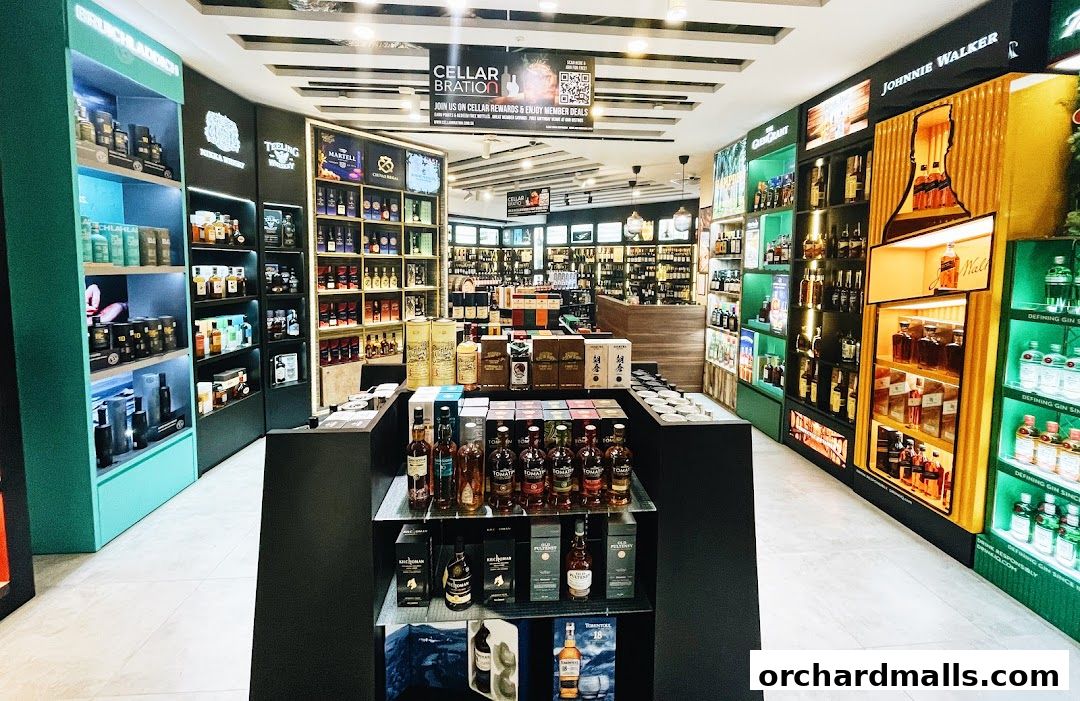 Interior view of a well-stocked liquor and wine store with shelves of bottles and displays.