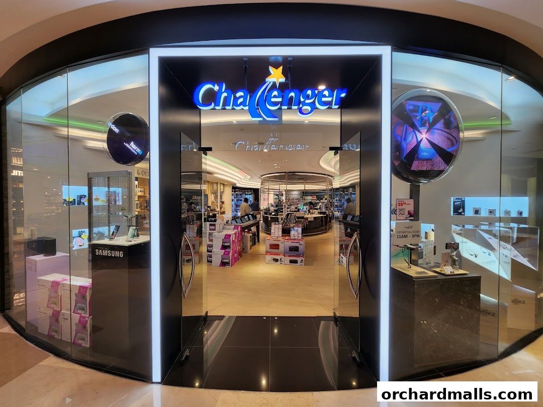 The entrance of the Challenger electronics store at ION Orchard, showcasing various gadgets and promotions.