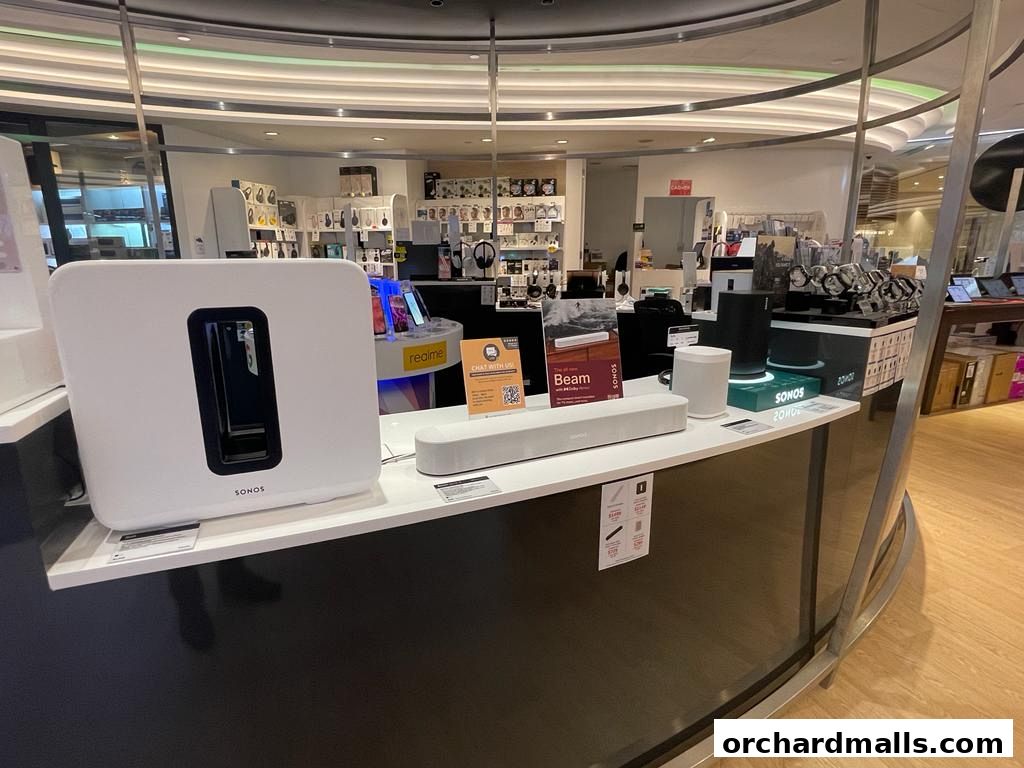 Challenger store interior showcasing Sonos audio products and other electronics on display.