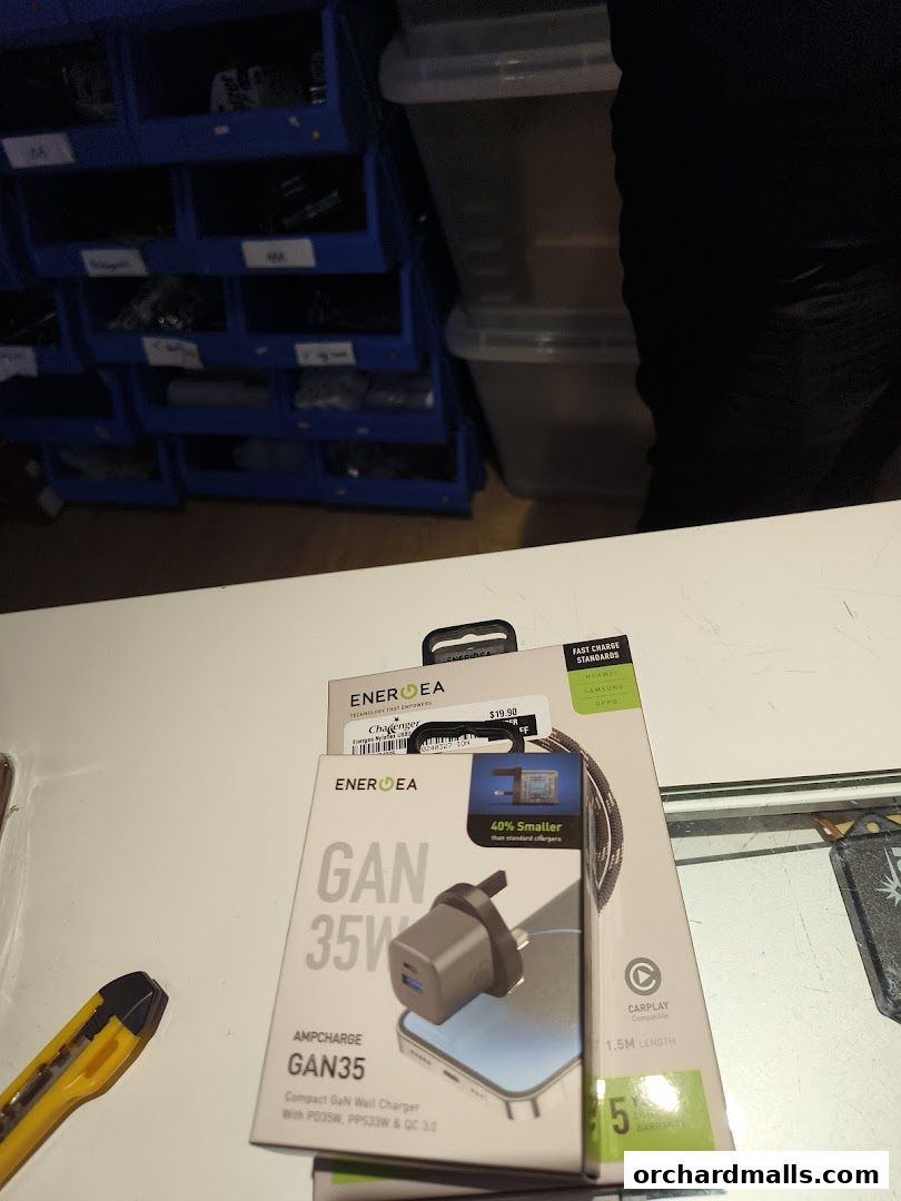Energea GAN 35W wall charger and other tech accessories are displayed.