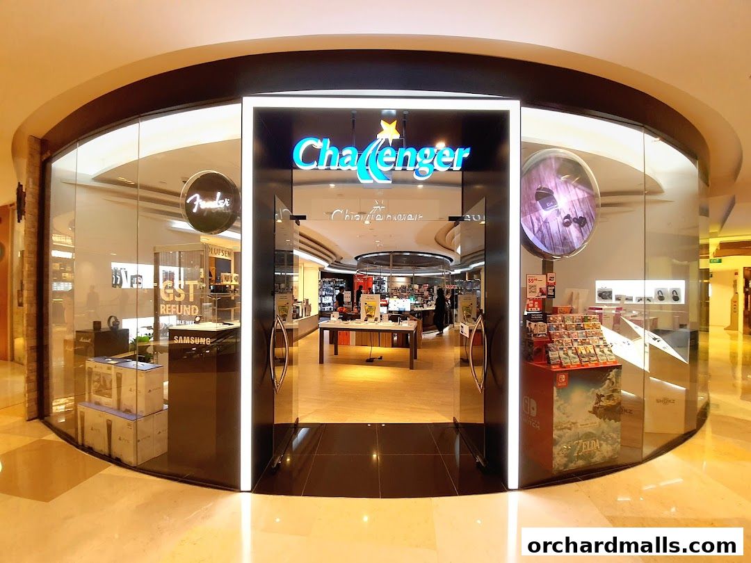 The exterior of the Challenger electronics store at ION Orchard, showcasing various products and the store's branding.