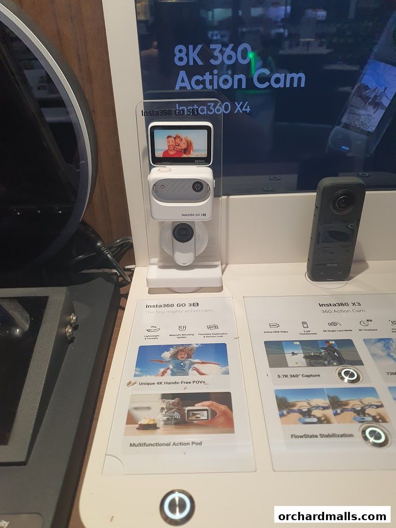 Display of Insta360 action cameras, including the GO 3 and X3 models, showcasing their features.