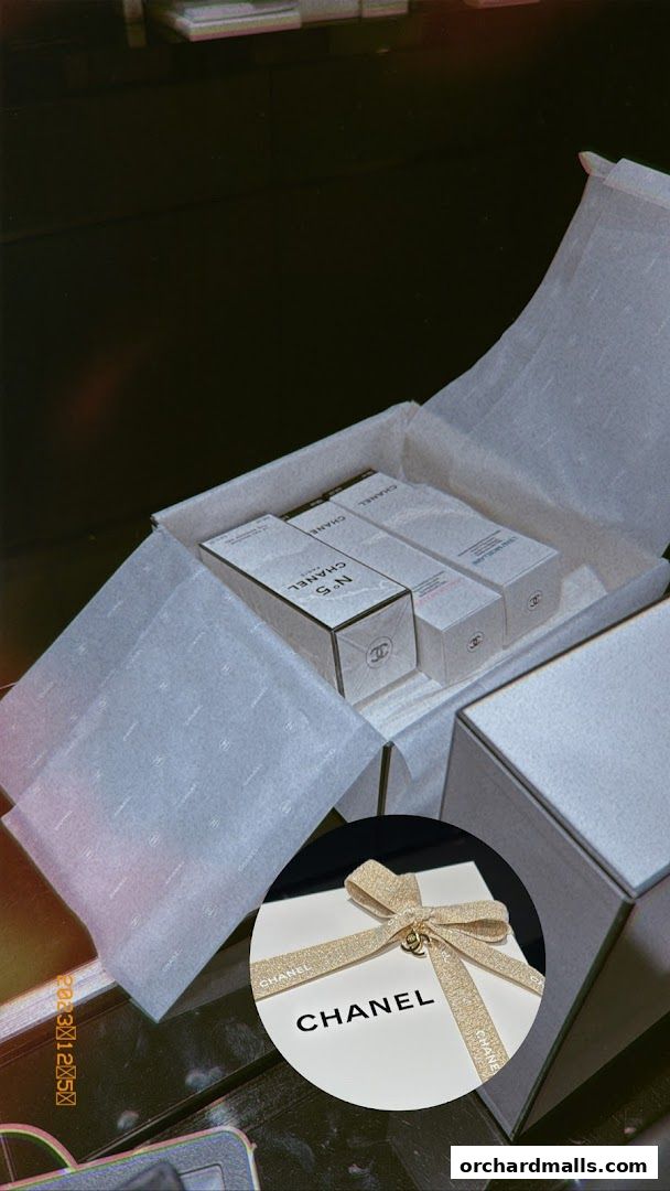 Chanel N°5 beauty products elegantly packaged in a gift box with branded tissue paper.