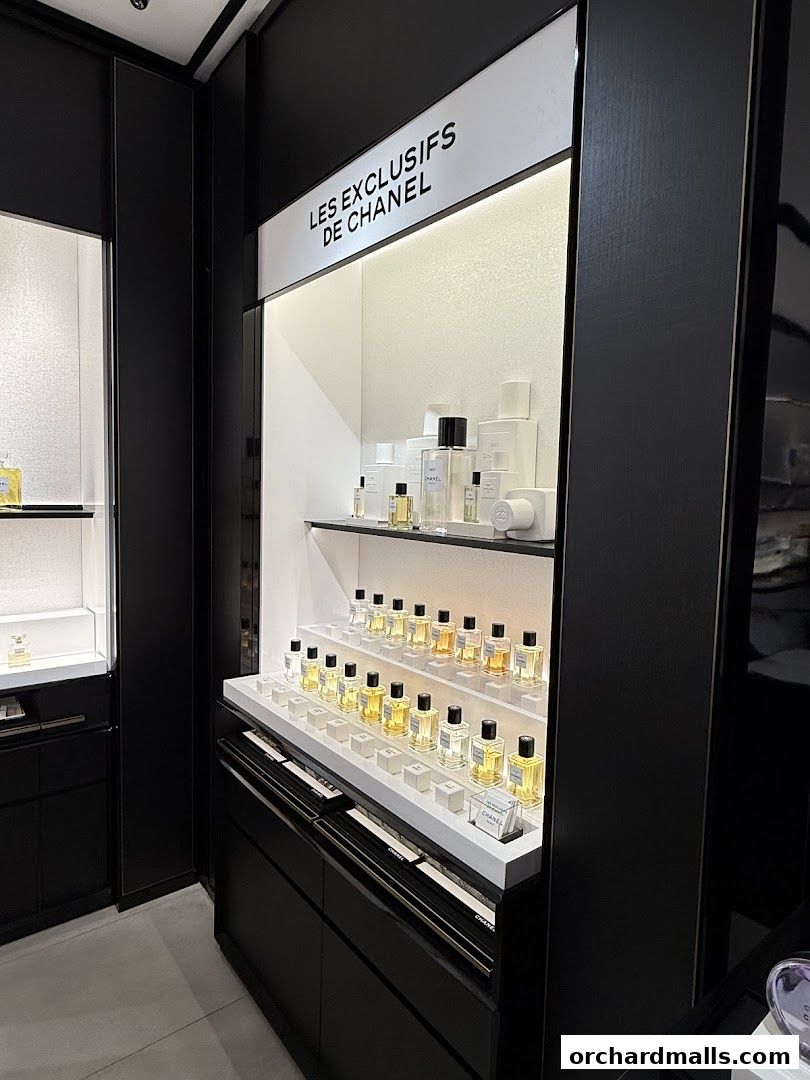 Chanel Beauty Boutique interior showcasing 'Les Exclusifs de Chanel' fragrances on display.