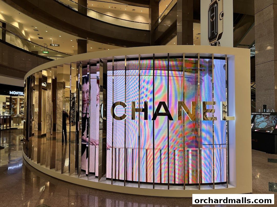 Chanel Watches and Fine Jewellery store with a large illuminated display in a mall.