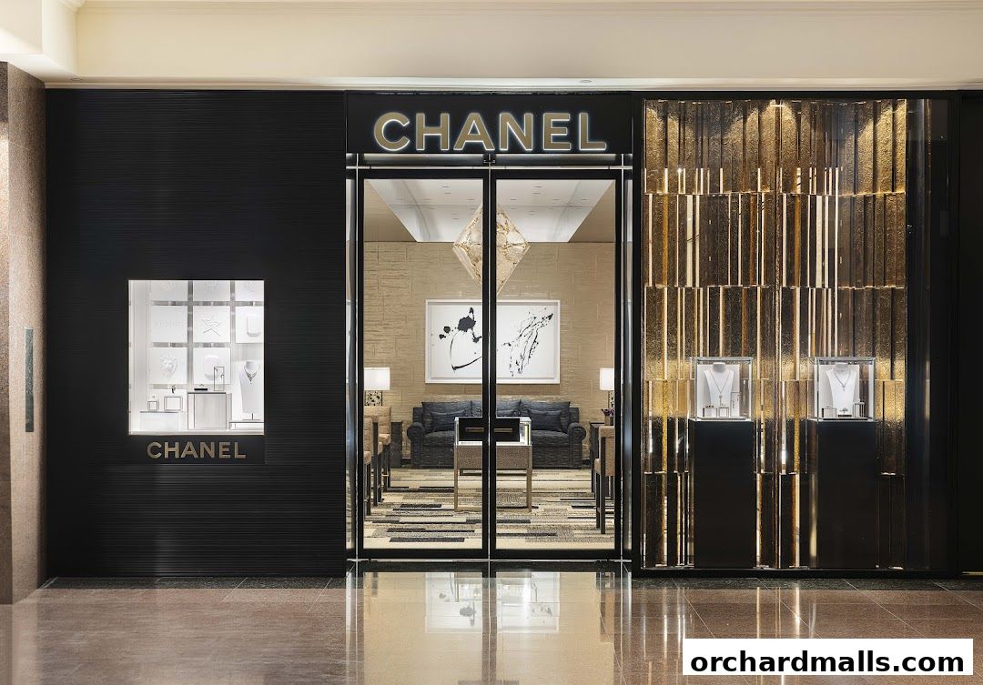 The elegant Chanel Watches and Fine Jewellery store entrance with illuminated displays.