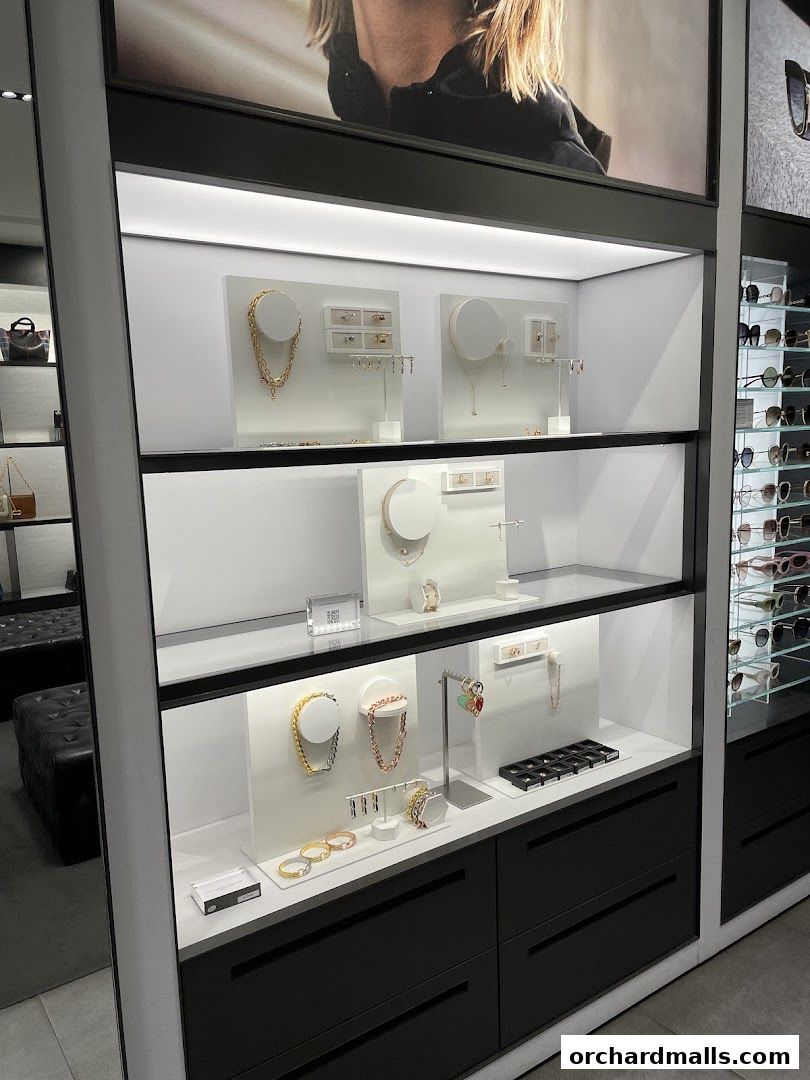 Display shelves showcasing various jewelry items like necklaces, bracelets, and earrings.