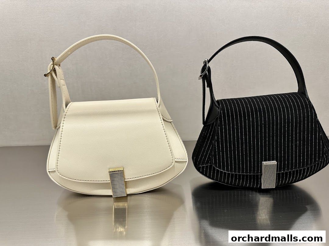 Two stylish handbags, one cream and one black pinstripe, displayed on a reflective surface.