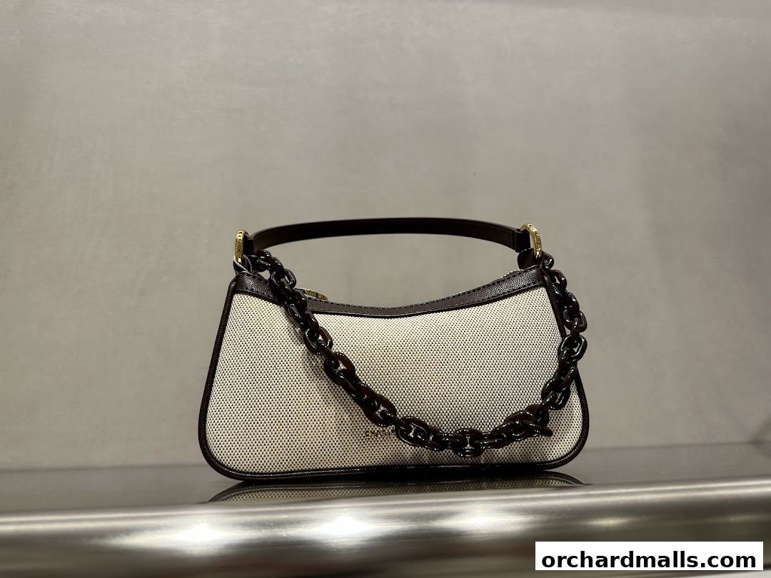 A stylish canvas handbag with a dark brown chain strap and leather trim.